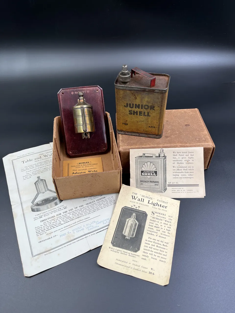 Muhlex patent wall lighter and Junior Shell spirit tin